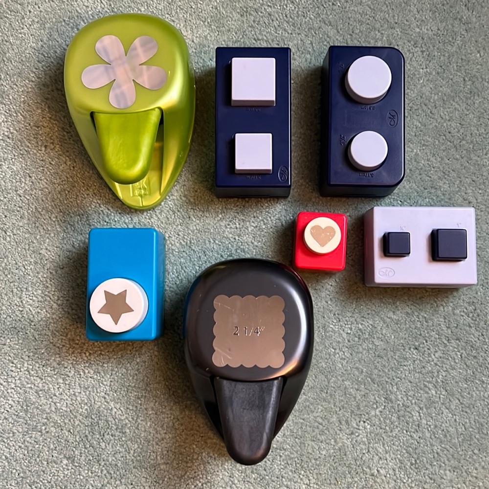 Seven different paper punches for crafting. Perfect for scrapbooking.